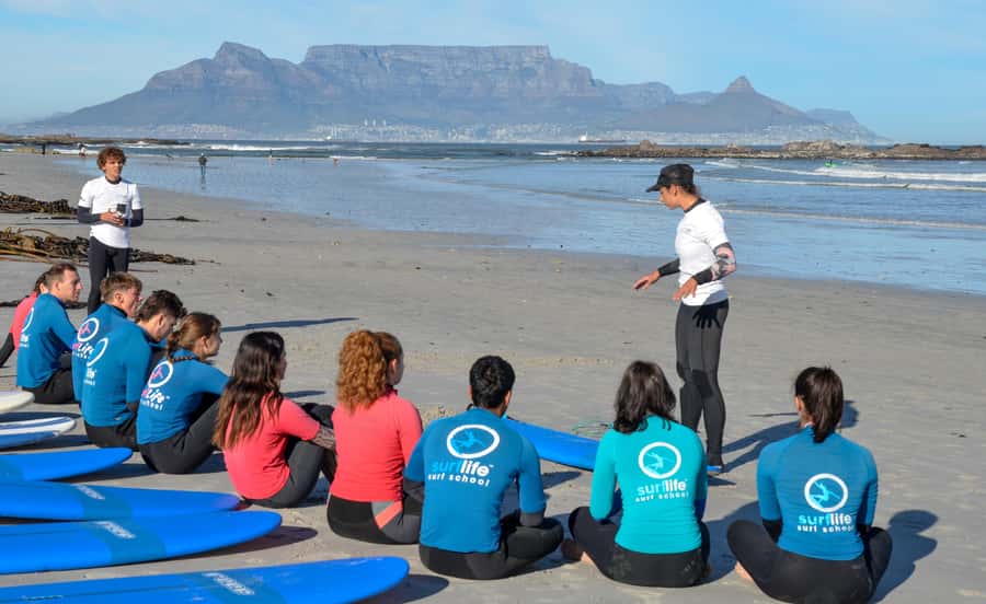 Cape Town:Learn to surf with the best view of Table Mountain - Starting at Eden on the Bay with Table Mountain ahead