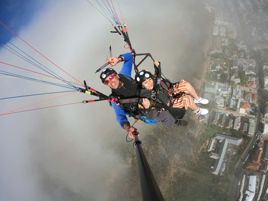 Cape Town: Tandem Paragliding Flight with the Experts - Languages, booking flexibility, and cancellation