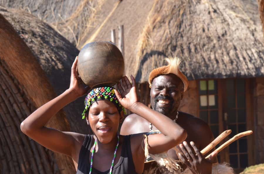 Durban: Phezulu Cultural Village & Reptile Park Tour - Entering the traditional beehive-shaped huts