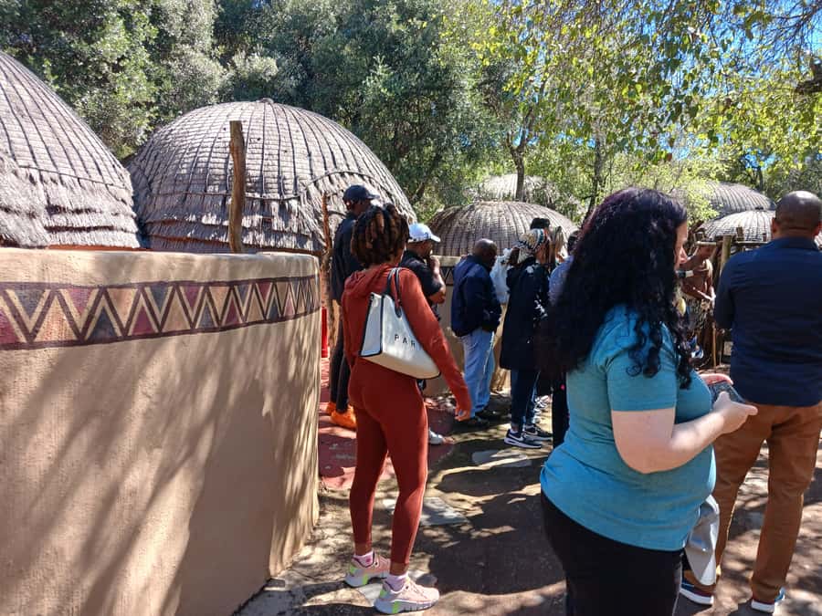 Johannesburg: Lesedi Cultural Village Show with Pickup - Drums and painted walls set the mood