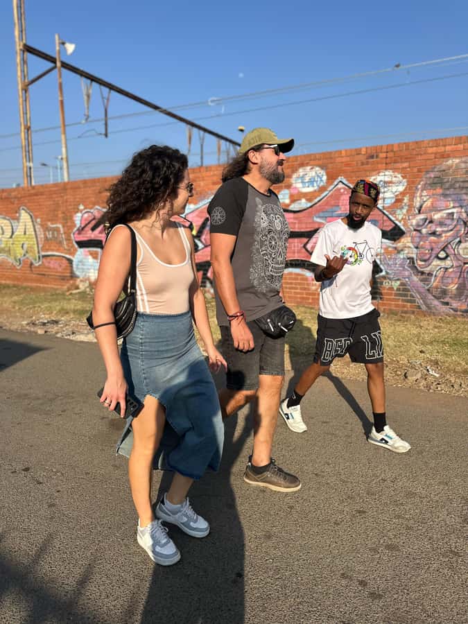 Soweto: Sip & Paint Walking Tour & Take Home a Canvas - The wine stop and the move indoors